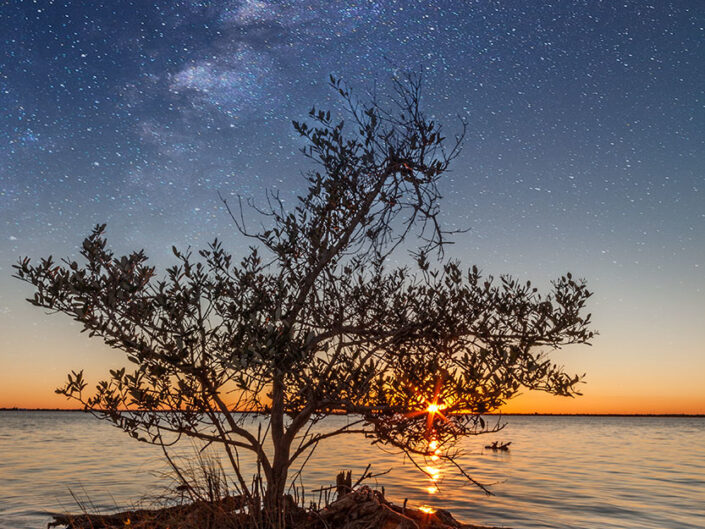 Composite image of the Milkyway galaxy with the sunset viewed from the Manatee Park in Cape Canaveral, Florida.